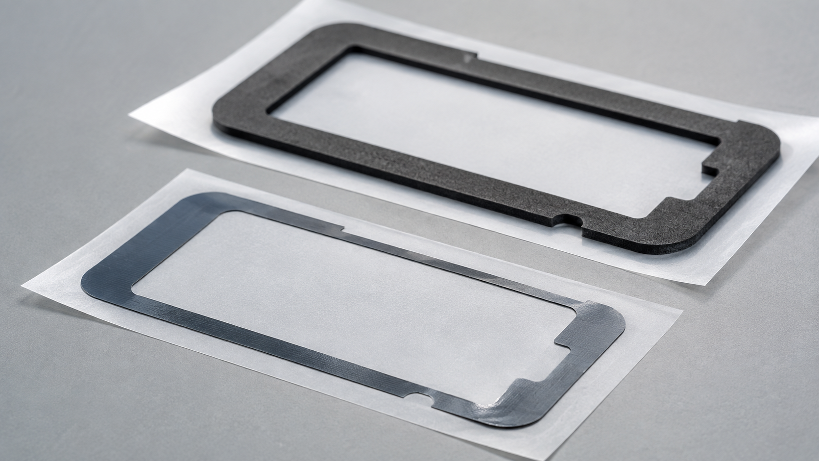 Narrow-border die-cut adhesive tape frames showing rounded corners and controlled openings